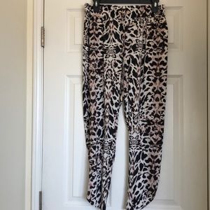 Bebe black lion print loose flowy pants.